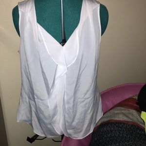 White blouse. Sleveless.